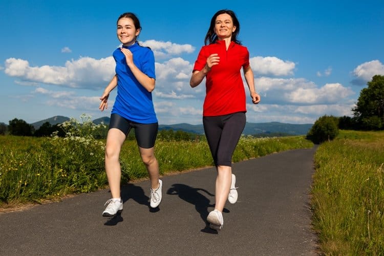 Teen and young adult runners training outdoors